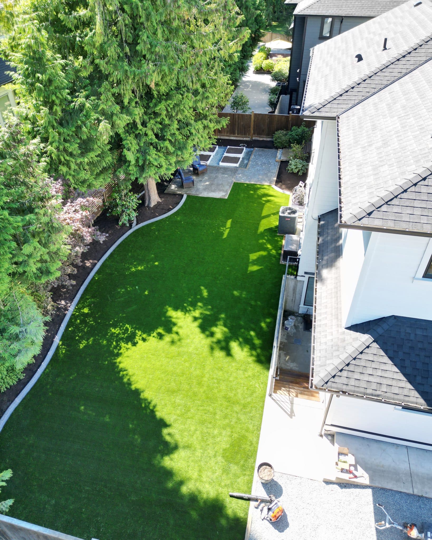 An aerial view of a backyard with artificial grass.