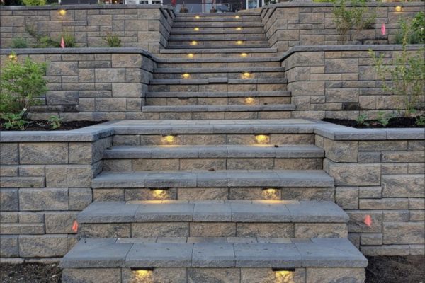 A stone stairs with lights on.
